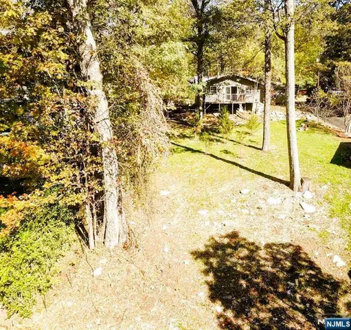 a view of residential houses with swimming pool
