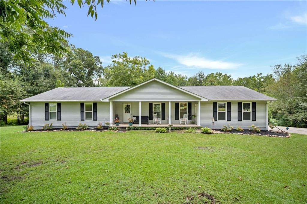429 Mein Mitchell Road Hiram, GA 30141 - Photo 1 of 1 a front view of a house with garden