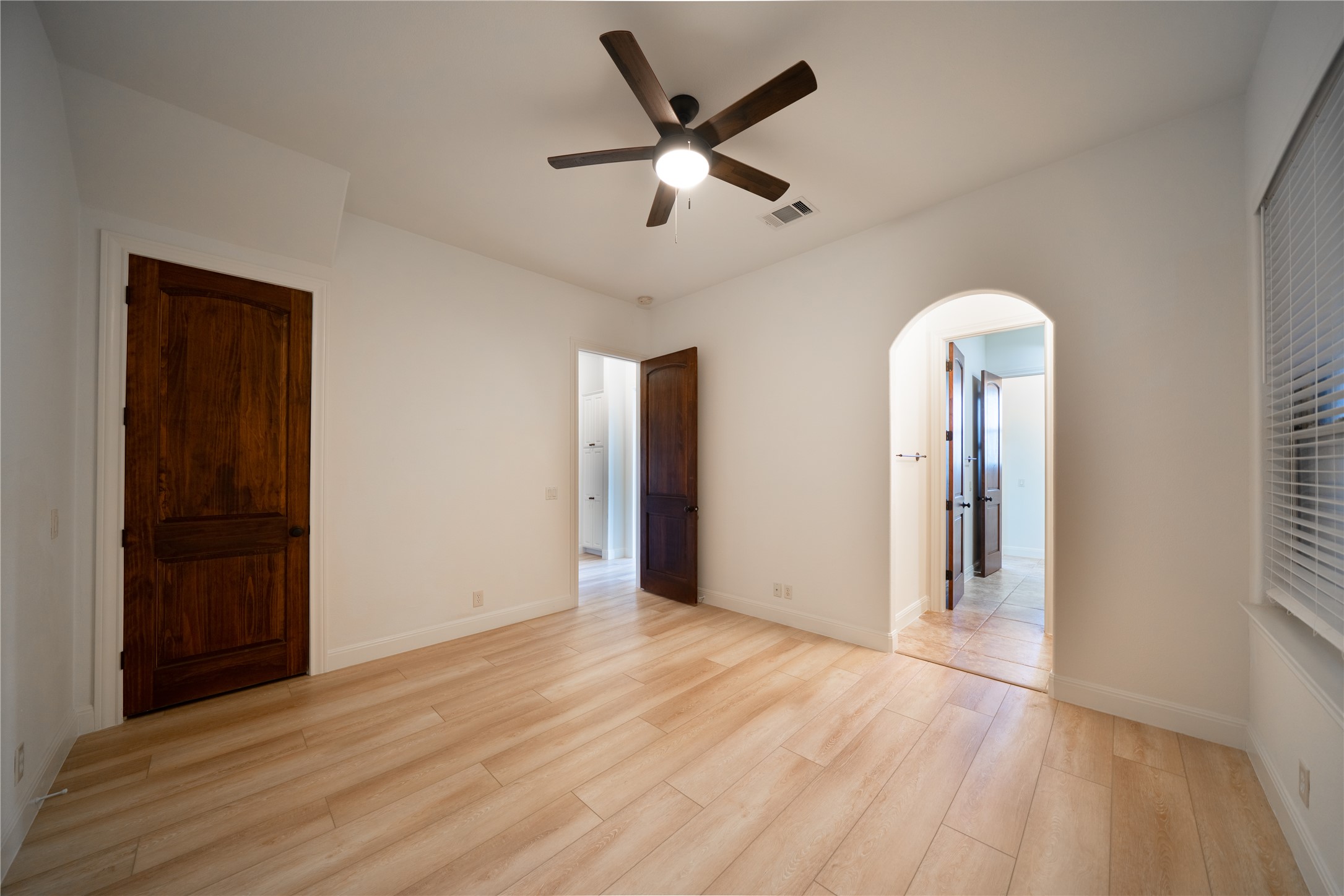 17545 West Reed Park Road, Unit 2 Jonestown, TX 78645 - Photo 25 of 39 wooden floor in an empty room with a window