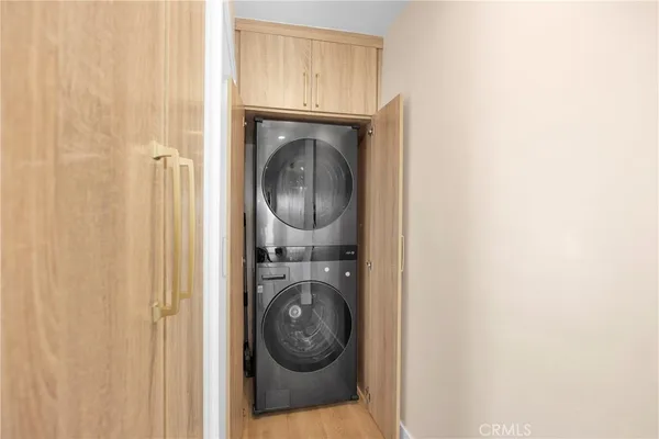 a view of storage and utility room with washer and dryer