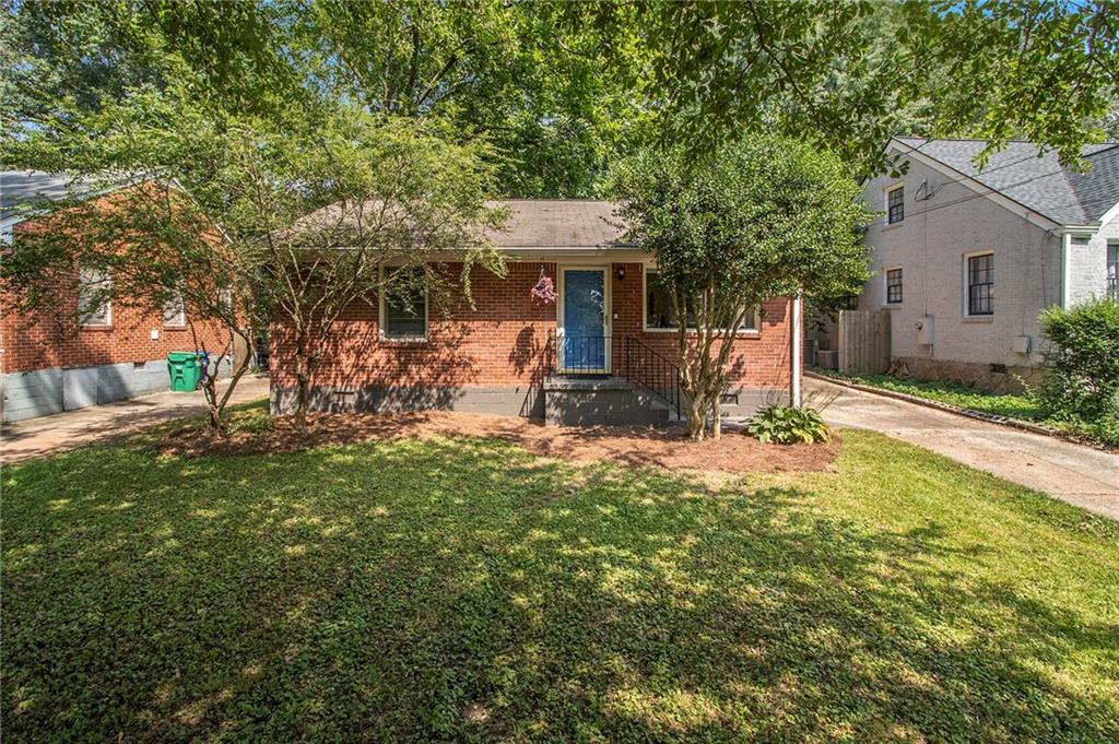 614 Parker Avenue Decatur, GA 30032 - Photo 1 of 1 a front view of a house with a yard