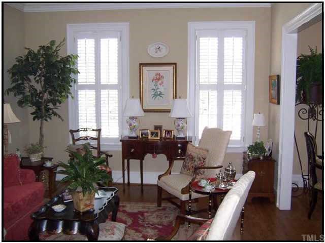 1701 Knox Road Raleigh, NC 27608 - Photo 3 of 6 a living room with furniture potted plant and a window