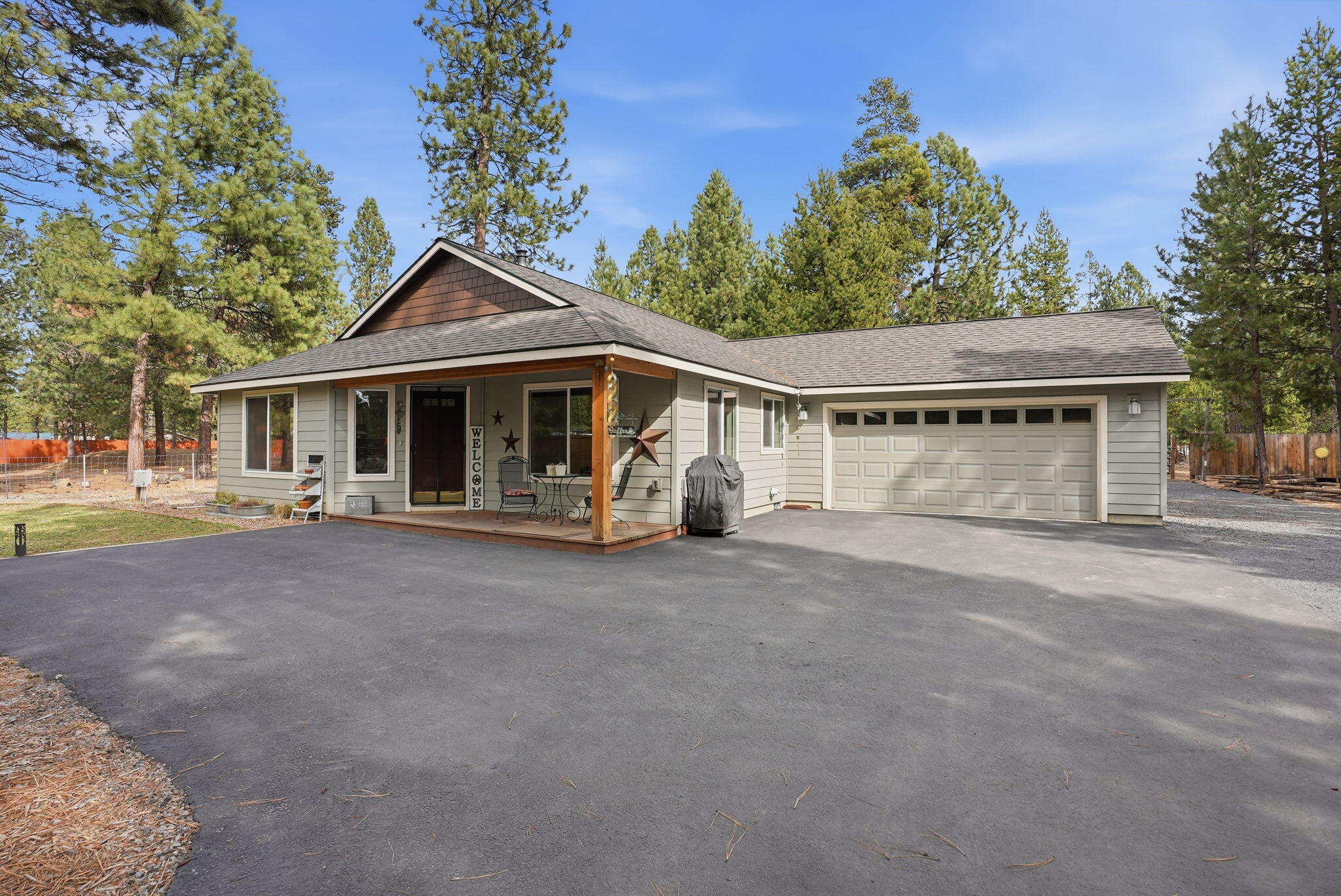 51432 Jory Road La Pine, OR 97739 - Photo 48 of 51 a view of a white house with a large space and large trees