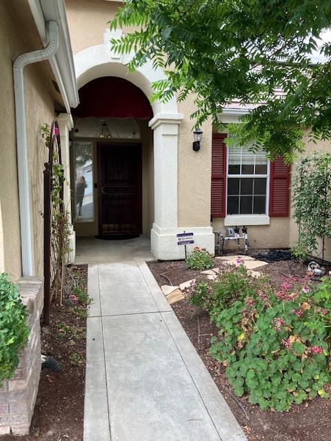 2157 West Rue St Michel Fresno, CA 93711 - Photo 2 of 22 a front view of a house with a yard