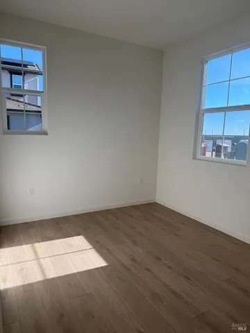 an empty room with a empty space and window