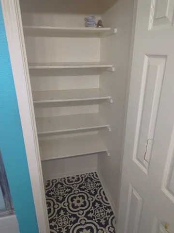 a bathroom with a white toilet and a sink