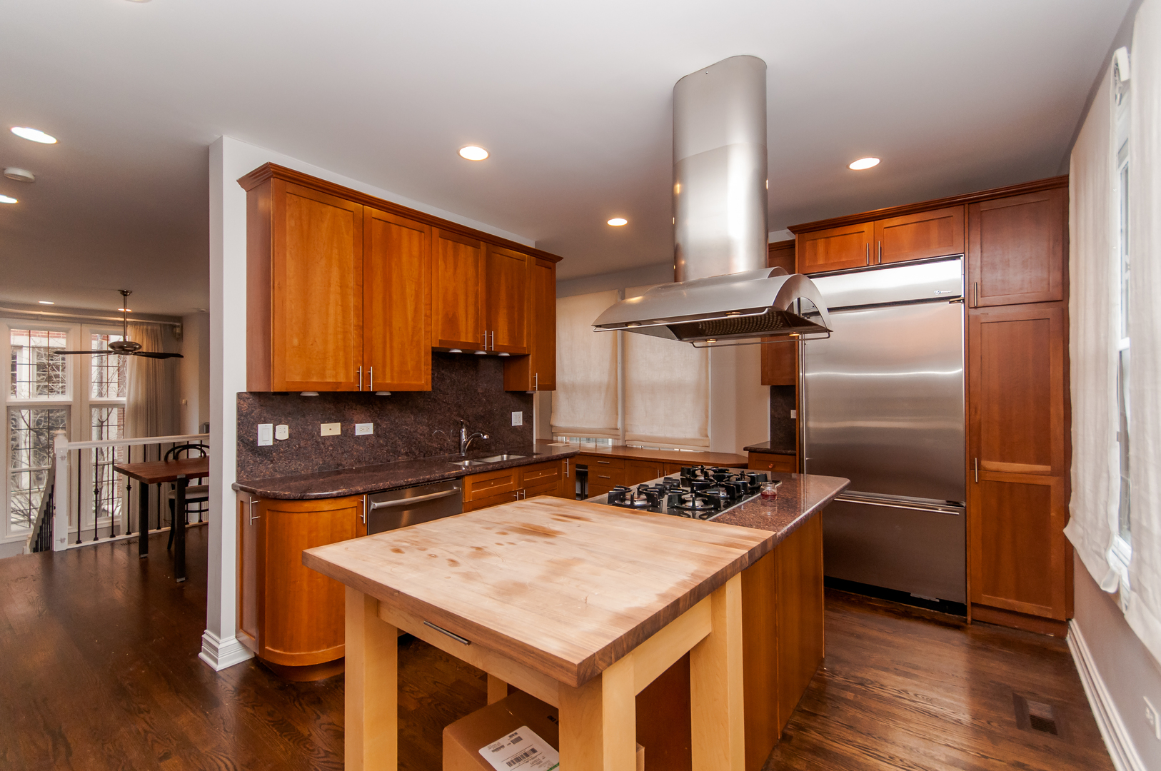 24 North Ada Street, Unit I Chicago, IL 60607 - Photo 5 of 12 a kitchen with a sink and refrigerator