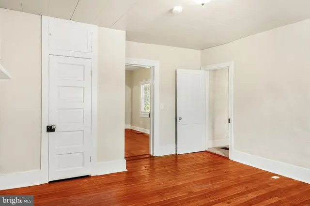 a view of an entryway with wooden floor