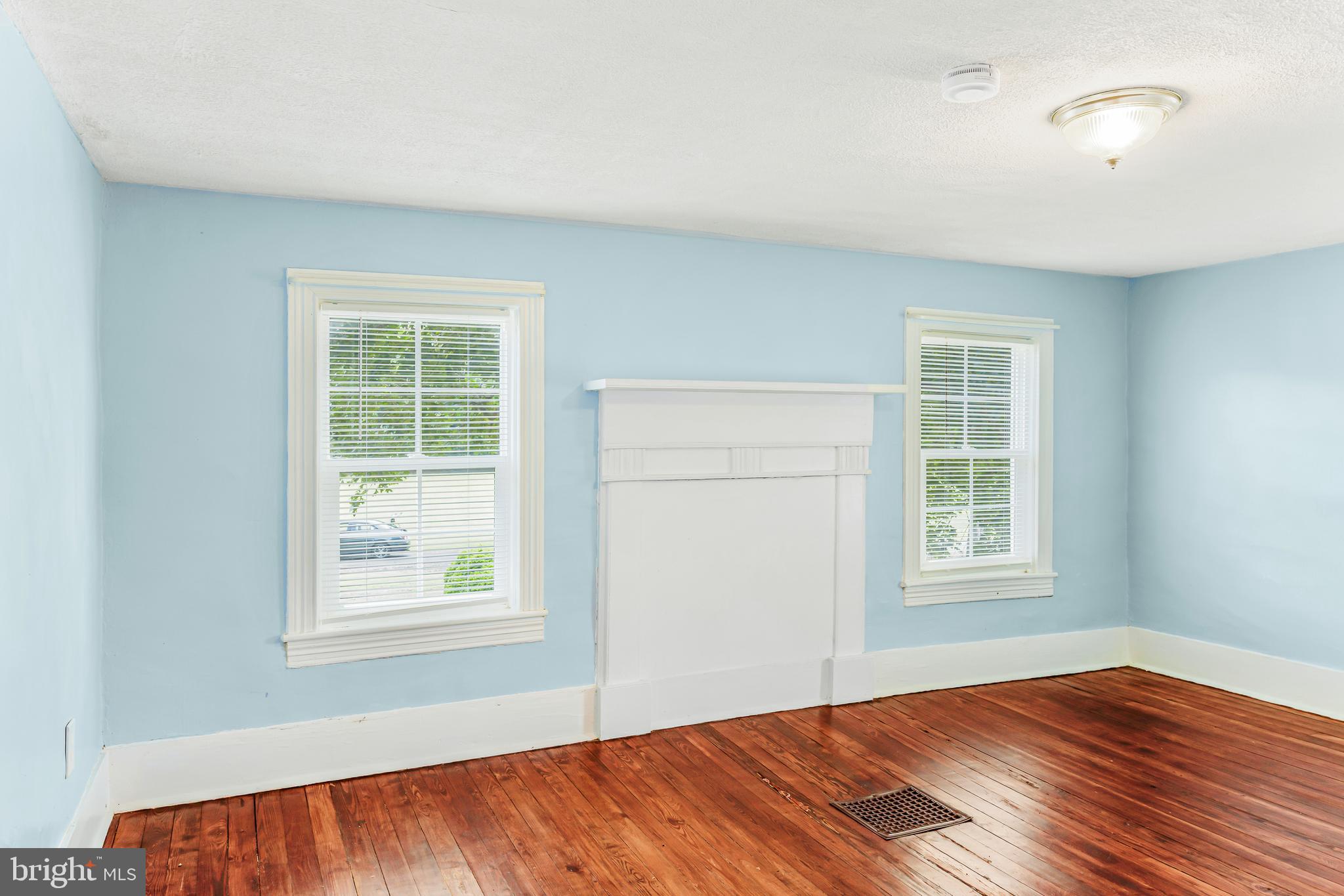 10287 Dahlgren Road King George, VA 22485 - Photo 27 of 54 an empty room with wooden floor and windows