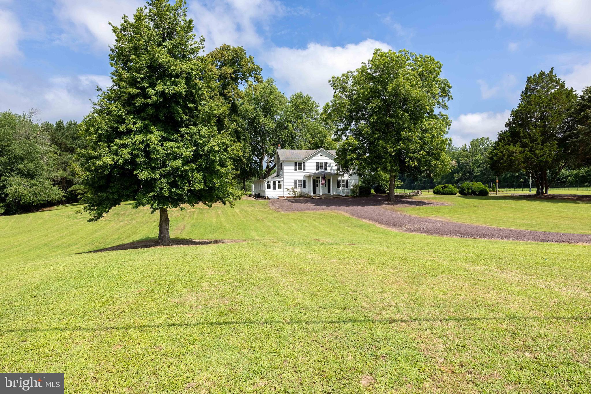 10287 Dahlgren Road King George, VA 22485 - Photo 36 of 54 a view of a yard with a house and large trees
