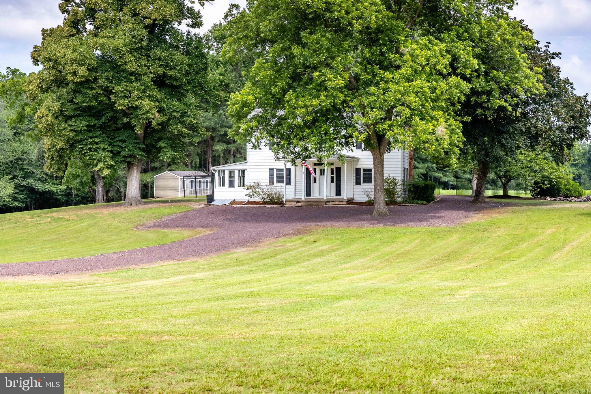 10287 Dahlgren Road King George, VA 22485 - Photo 39 of 54 a view of swimming pool with lawn chairs and large trees