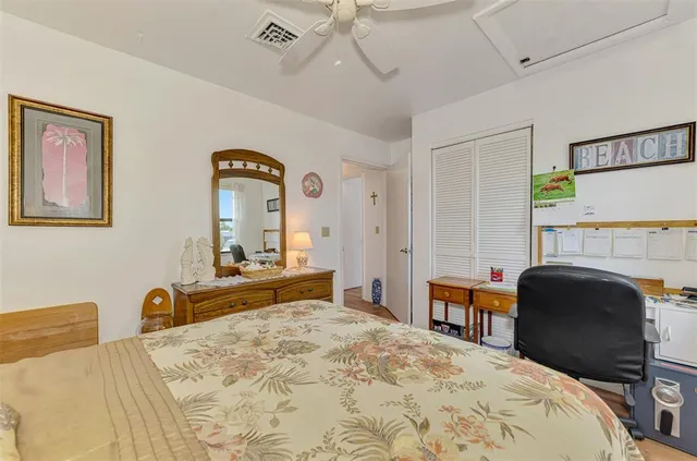 a bedroom with a bed and a dresser