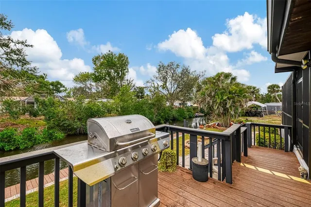 a view of a roof deck with wooden floor and fence
