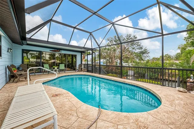 a view of a swimming pool with a patio