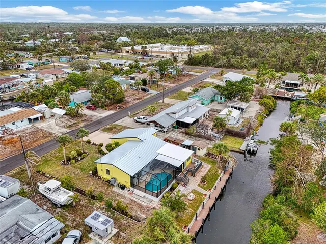 an aerial view of residential houses with outdoor space