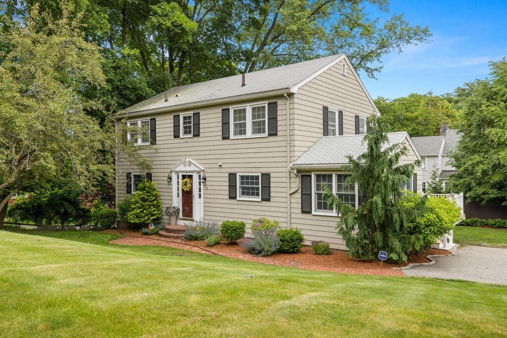 155 Main Street Winchester, MA 01890 - Photo 1 of 35 a view of a house with a yard and plants