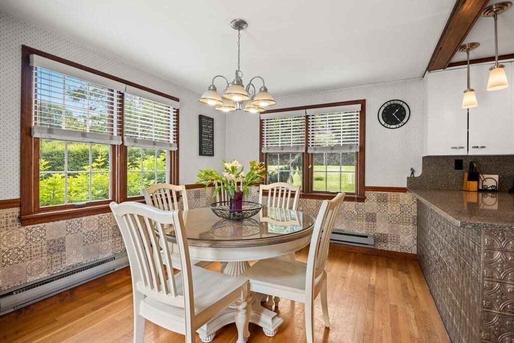 155 Main Street Winchester, MA 01890 - Photo 13 of 35 a view of a dining room with furniture window and wooden floor
