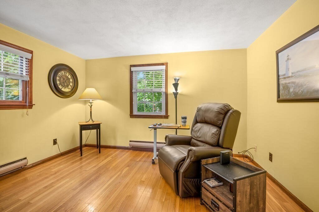 155 Main Street Winchester, MA 01890 - Photo 15 of 35 a living room with furniture and a window