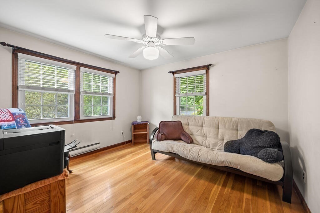 155 Main Street Winchester, MA 01890 - Photo 21 of 35 a living room with furniture and a large window