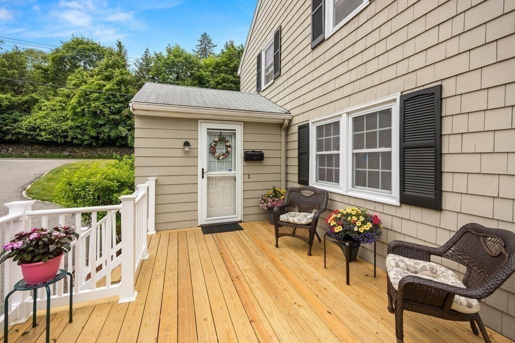 155 Main Street Winchester, MA 01890 - Photo 30 of 35 a view of a patio with table and chairs with wooden floor and fence