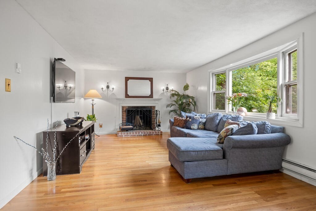 155 Main Street Winchester, MA 01890 - Photo 3 of 35 a living room with furniture and a fireplace