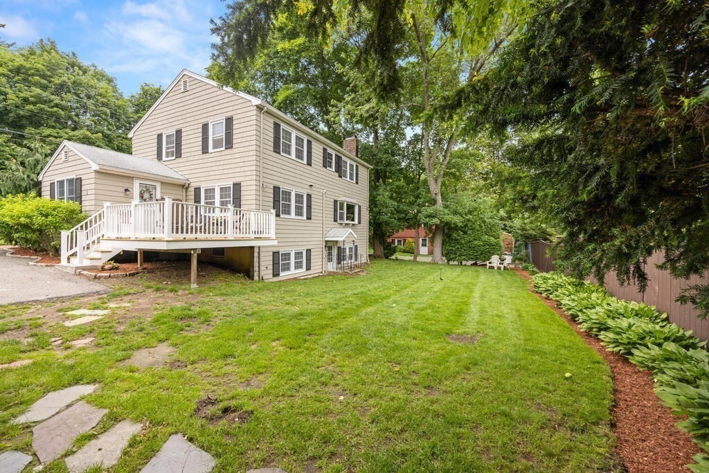 155 Main Street Winchester, MA 01890 - Photo 32 of 35 a view of a house with a yard deck and sitting area