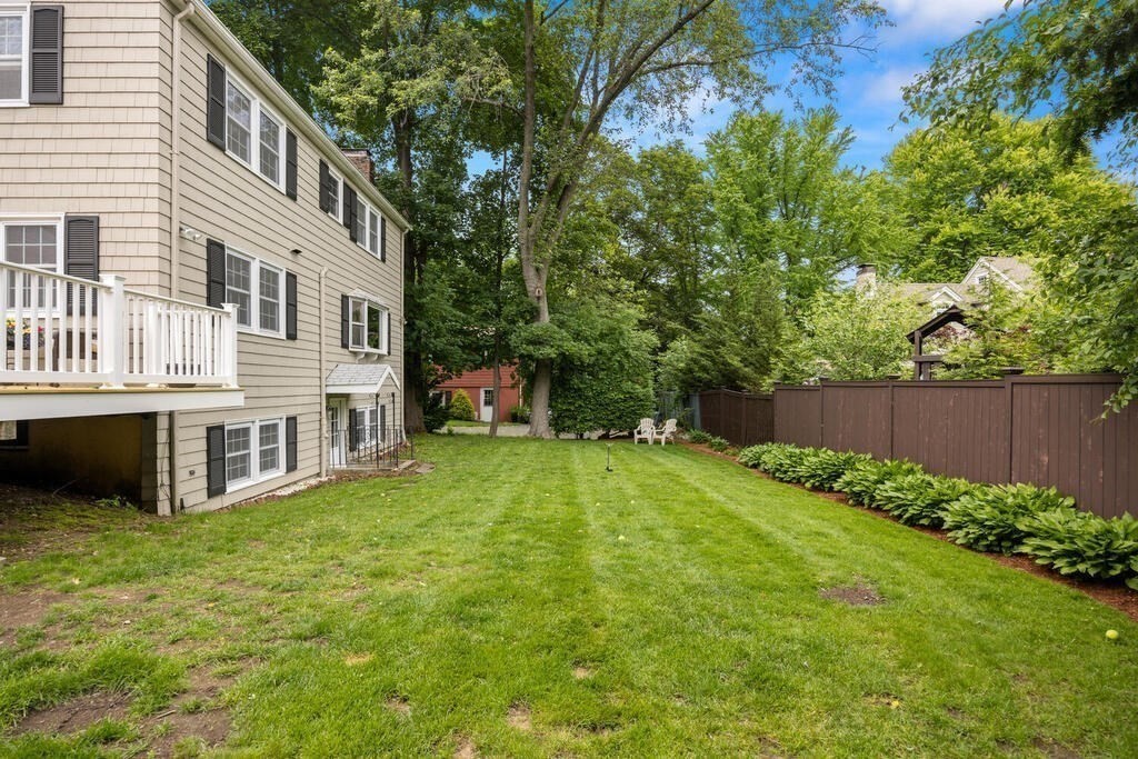 155 Main Street Winchester, MA 01890 - Photo 33 of 35 a view of a house with backyard and sitting area
