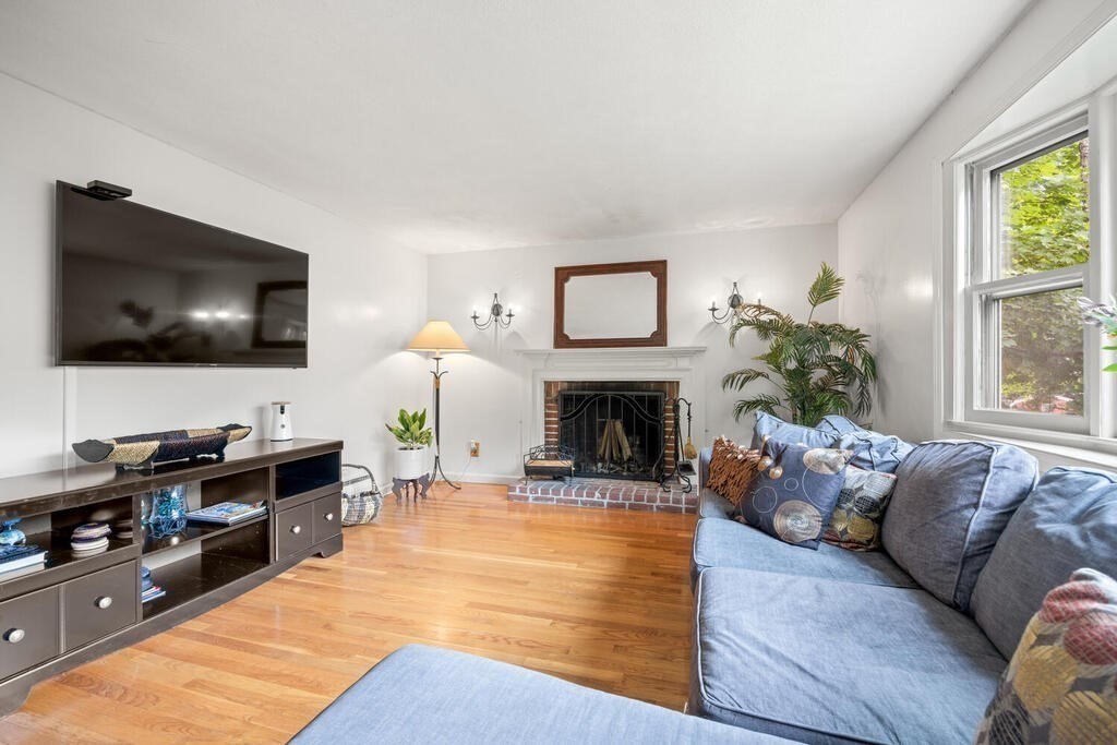155 Main Street Winchester, MA 01890 - Photo 5 of 35 a living room with furniture and a flat screen tv