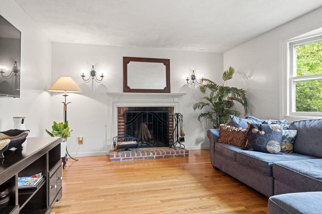 155 Main Street Winchester, MA 01890 - Photo 6 of 35 a living room with furniture and a fireplace