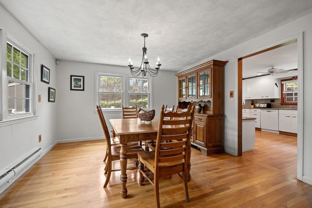 155 Main Street Winchester, MA 01890 - Photo 8 of 35 a view of a dining room with furniture and wooden floor