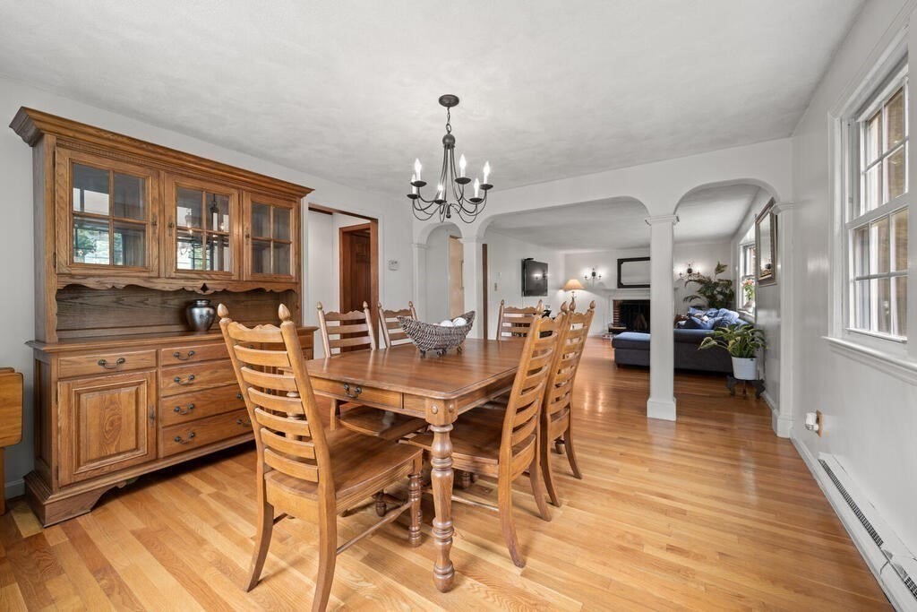 155 Main Street Winchester, MA 01890 - Photo 9 of 35 a view of a dining room with furniture and wooden floor