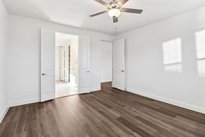 2448 Glacier Ridge Corinth, TX 76210 - Photo 13 of 27 an empty room with wooden floor and windows