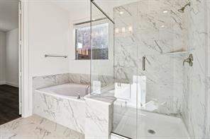 2448 Glacier Ridge Corinth, TX 76210 - Photo 15 of 27 a bath tub sitting next to a shower