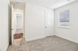 an empty room that has a window in it