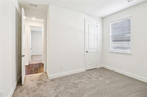 2448 Glacier Ridge Corinth, TX 76210 - Photo 17 of 27 an empty room that has a window in it