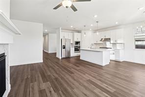 2448 Glacier Ridge Corinth, TX 76210 - Photo 4 of 27 a view of kitchen view wooden floors appliances and cabinets