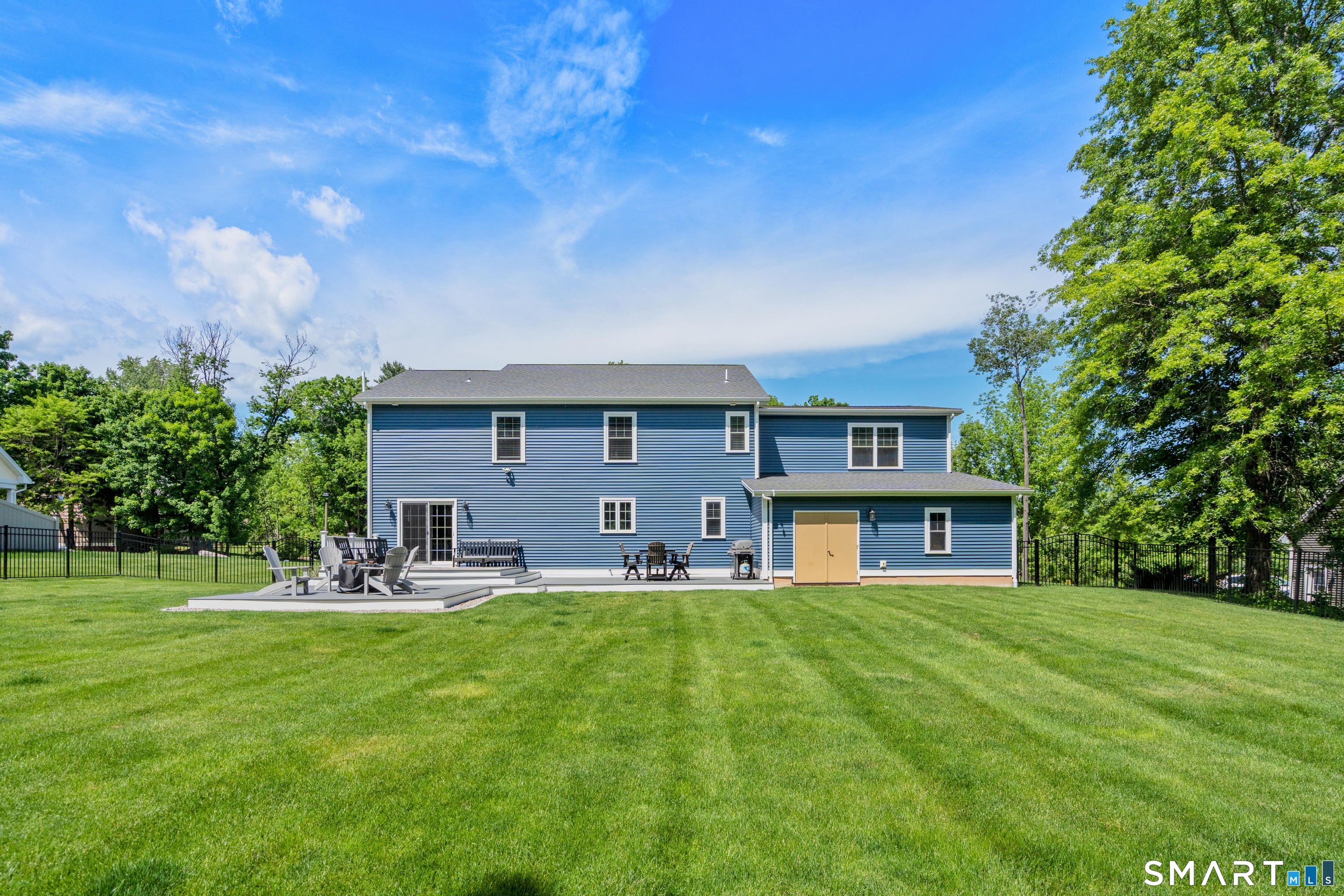 5 Limric Lane Suffield, CT 06078 - Photo 33 of 36 a house view with a sitting space and garden