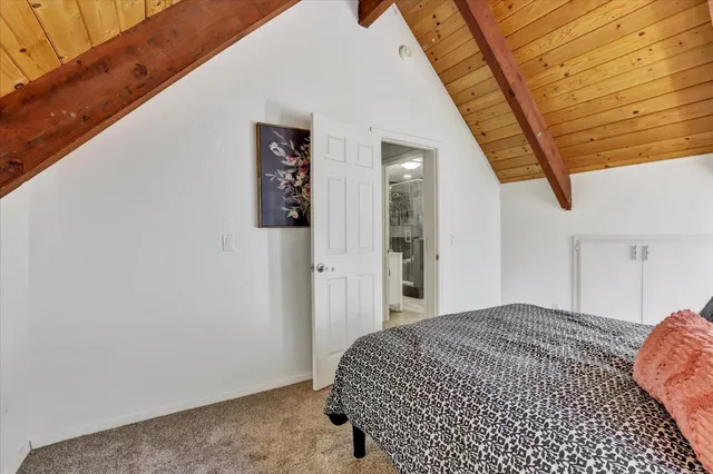 a view of an empty room and wooden floor
