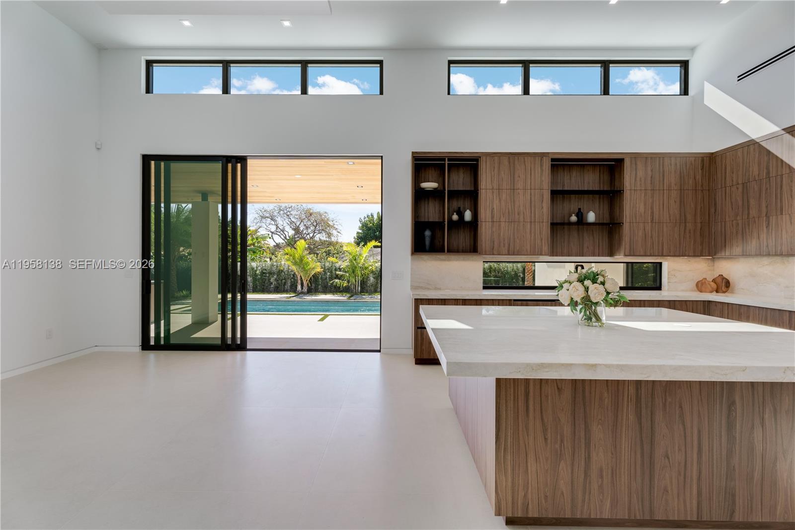 11000 Southwest 120th Street Miami, FL 33176 - Photo 22 of 75 a view of kitchen with kitchen island a refrigerator a sink and a large window
