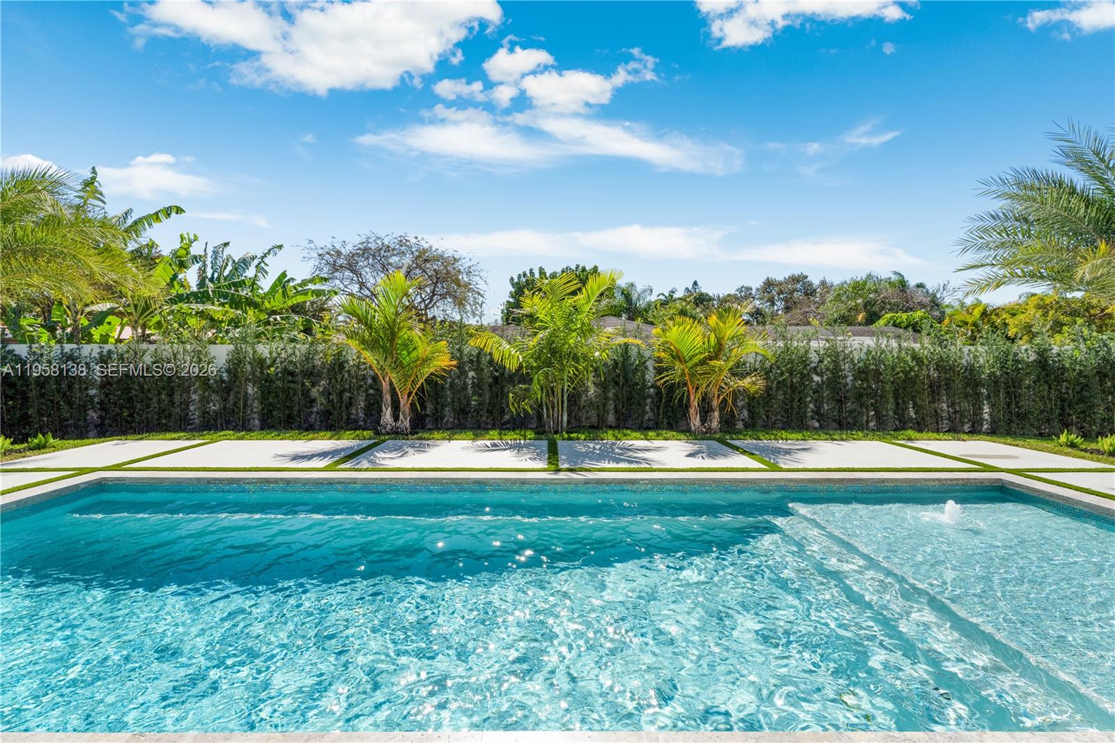 11000 Southwest 120th Street Miami, FL 33176 - Photo 60 of 75 a view of a swimming pool with an outdoor space and seating area
