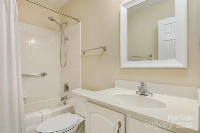 a bathroom with a sink toilet tub and shower