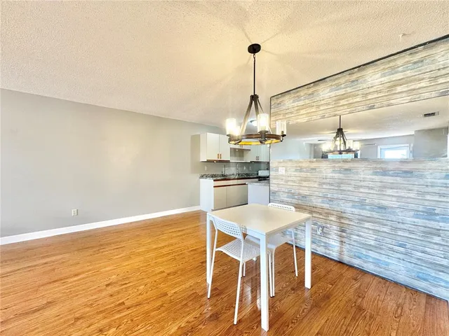 a view of a dining room and wooden floor