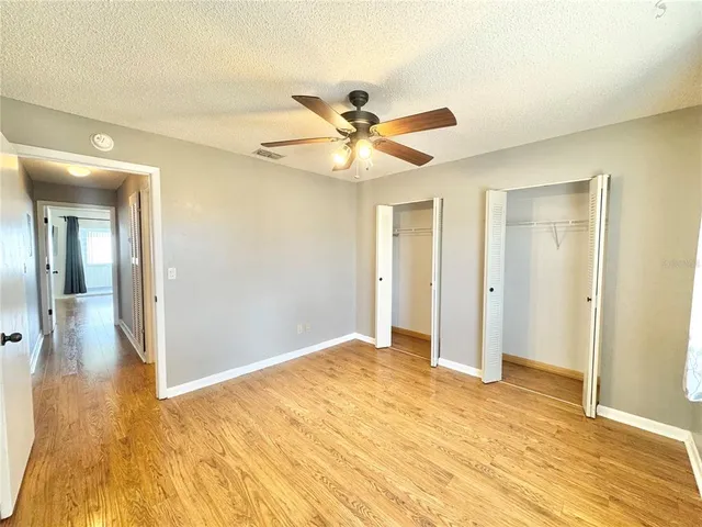 a view of livingroom with hardwood floor and a ceiling fan