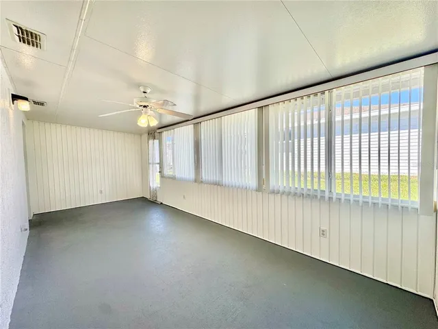 a view of room with furniture and a window