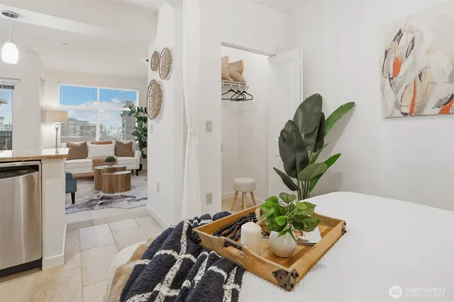 a living room with furniture flowerpot and a potted plant