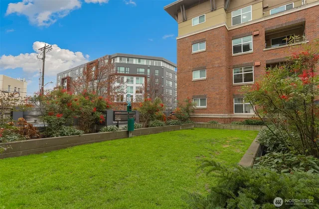 a view of a building next to a yard