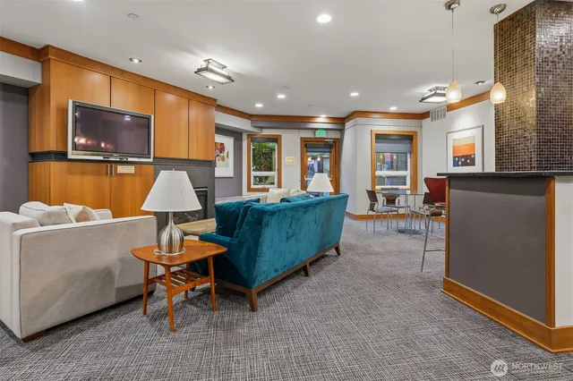 a dining room with furniture and wooden floor