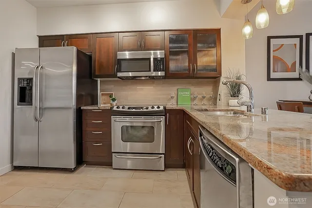 a kitchen with a sink stove and refrigerator