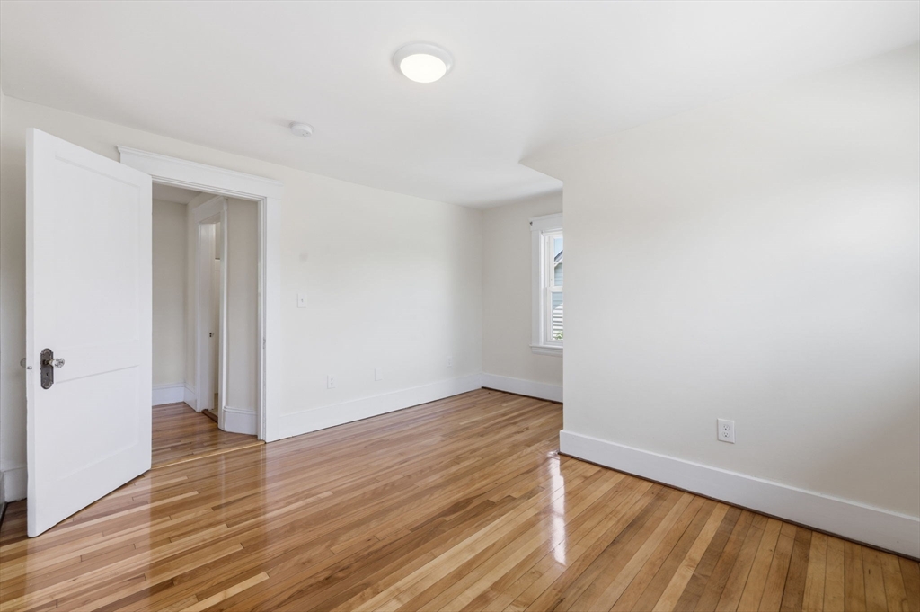 17 Rollinson Road Worcester, MA 01606 - Photo 24 of 41 an empty room with wooden floor and entrance