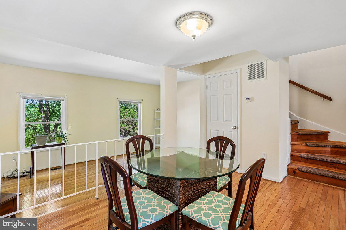 76 Timber Rock Road Gaithersburg, MD 20878 - Photo 15 of 51 a view of a dining room with furniture window and wooden floor